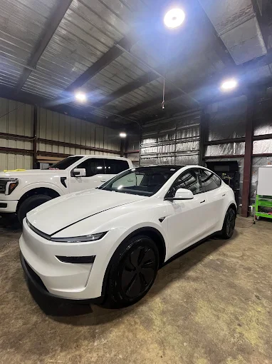 Car detailing done on white sedan car