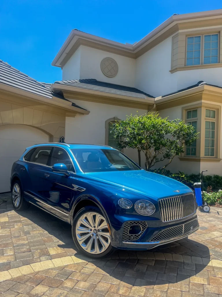 Newly detailed Bentley parked outside of villa in Sarasota, FL